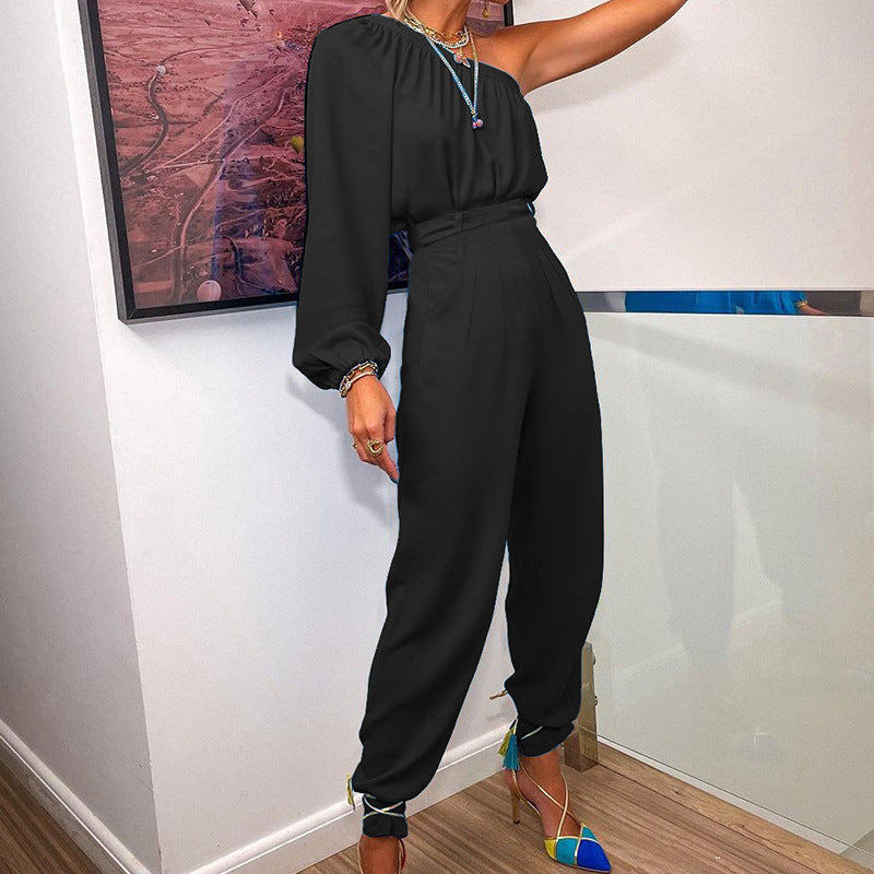 Women's jumpsuit with asymmetrical cut and elegant puff sleeves, size