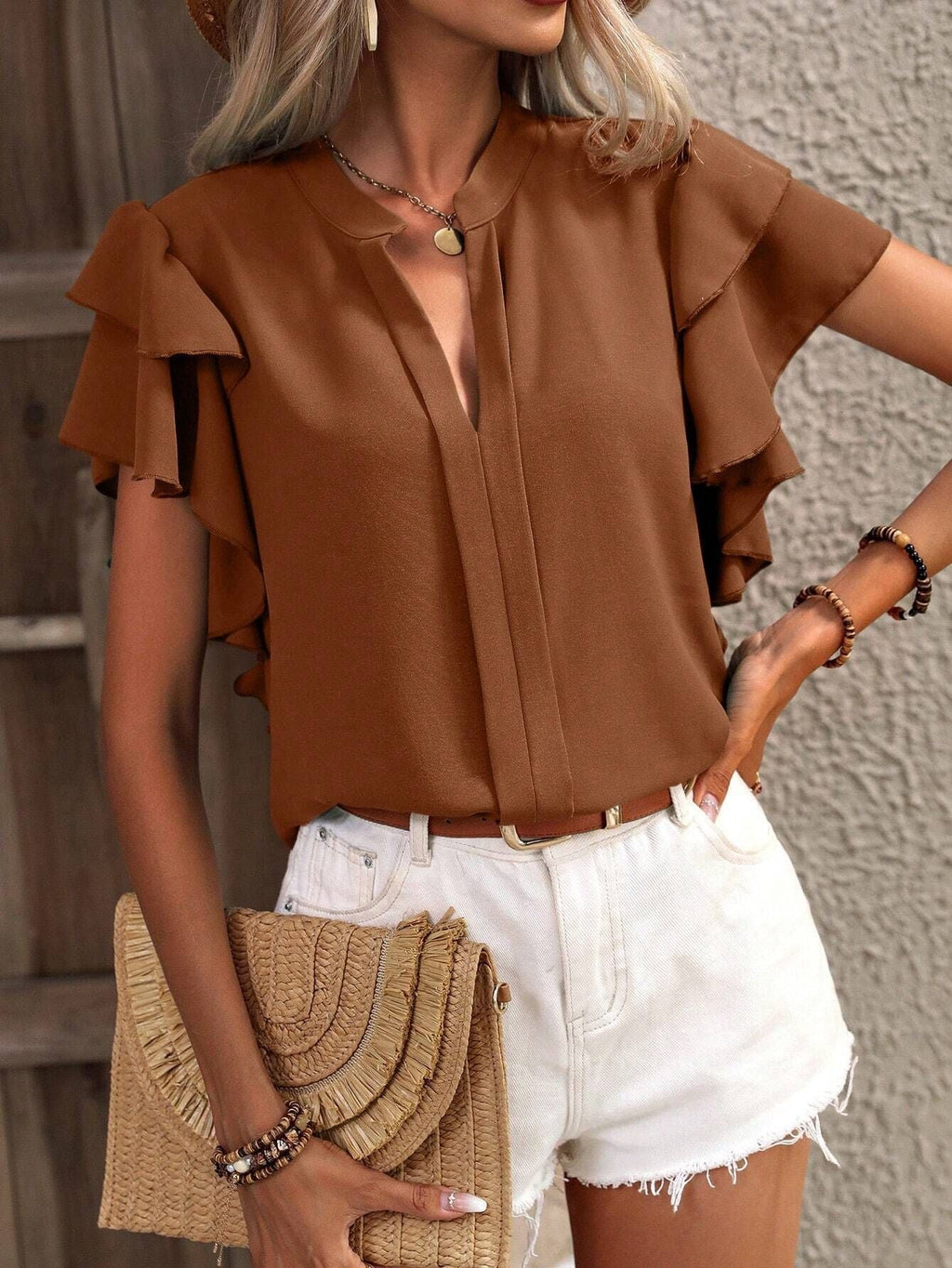 Women's blouse with decorative ruffle details and elegant V-neck, size [size missing]