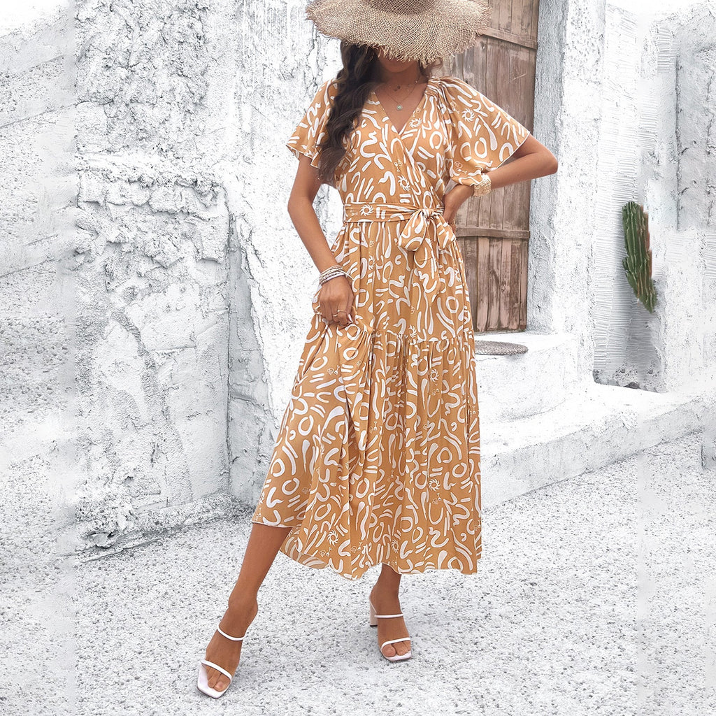 Women's wrap dress with voluminous sleeves and playful pattern, size S