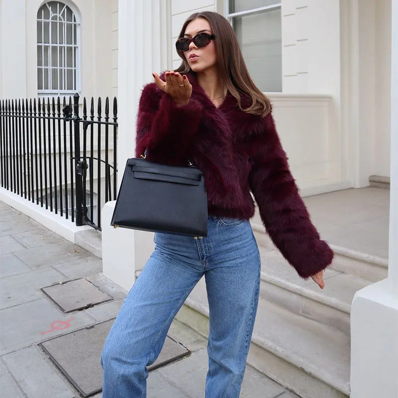 Women's faux fur jacket with a voluminous collar and elegant cut, size S