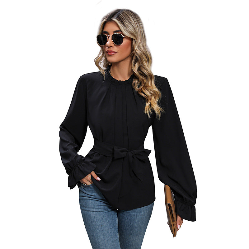 Women's blouse with decorative wrap belt and voluminous sleeves, size