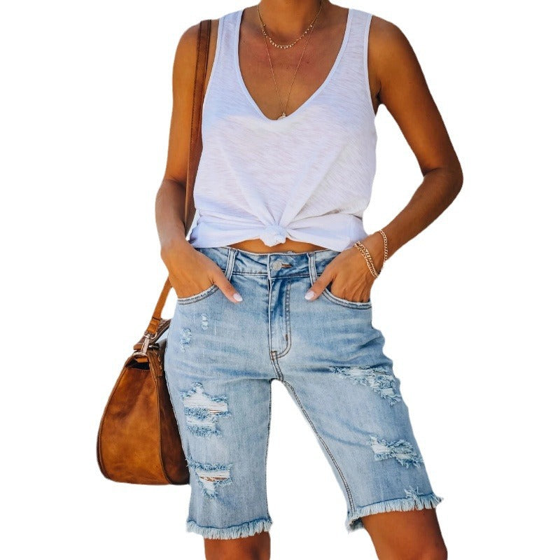 Women's distressed denim shorts in a relaxed fit with frayed hems, size [size missing]