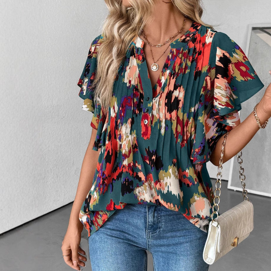 Women's blouse with elegant ruffle details and playful print, size S