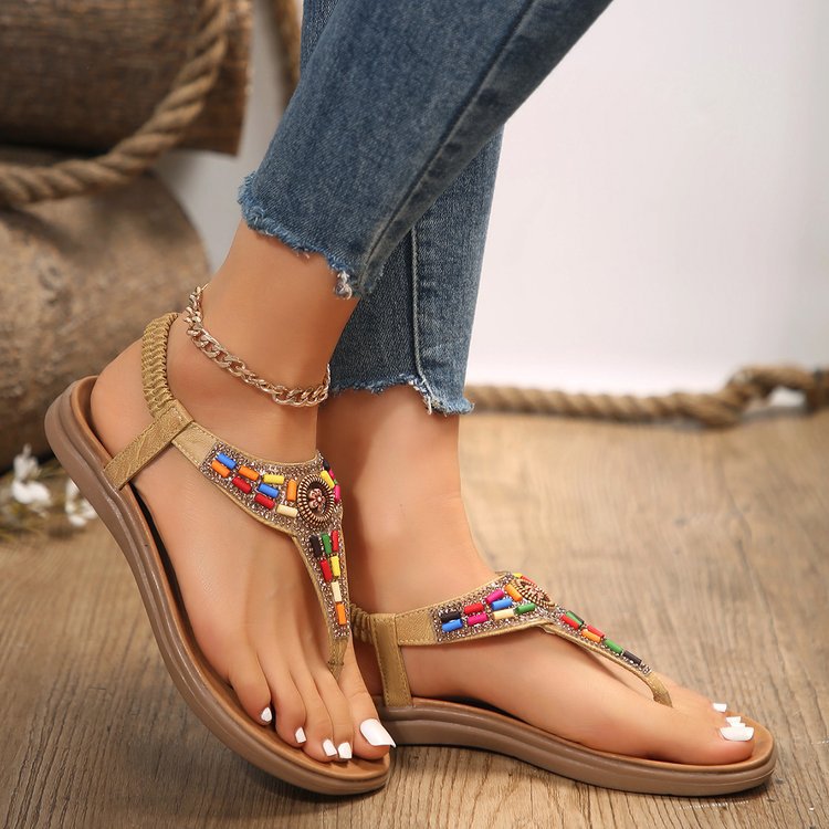 Women's thong sandals with colorful decorative detail and comfortable footbed design, size GR