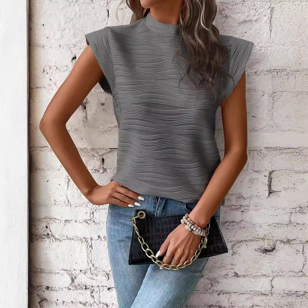 Women's elegant top with structured puff sleeves and high neckline, size S