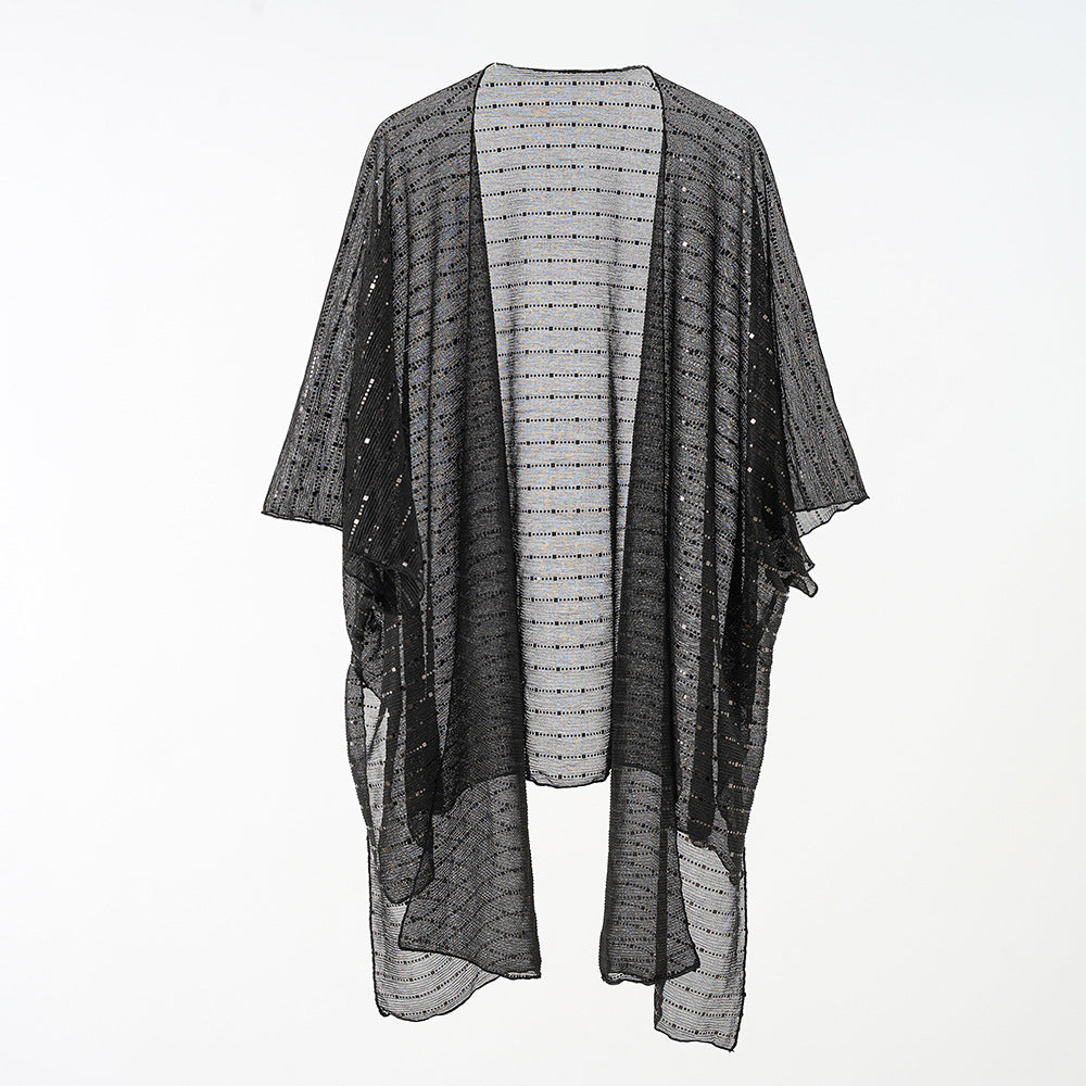 Women's elegant kaftan wrap with a fine crocheted design and asymmetrical edges, size GR