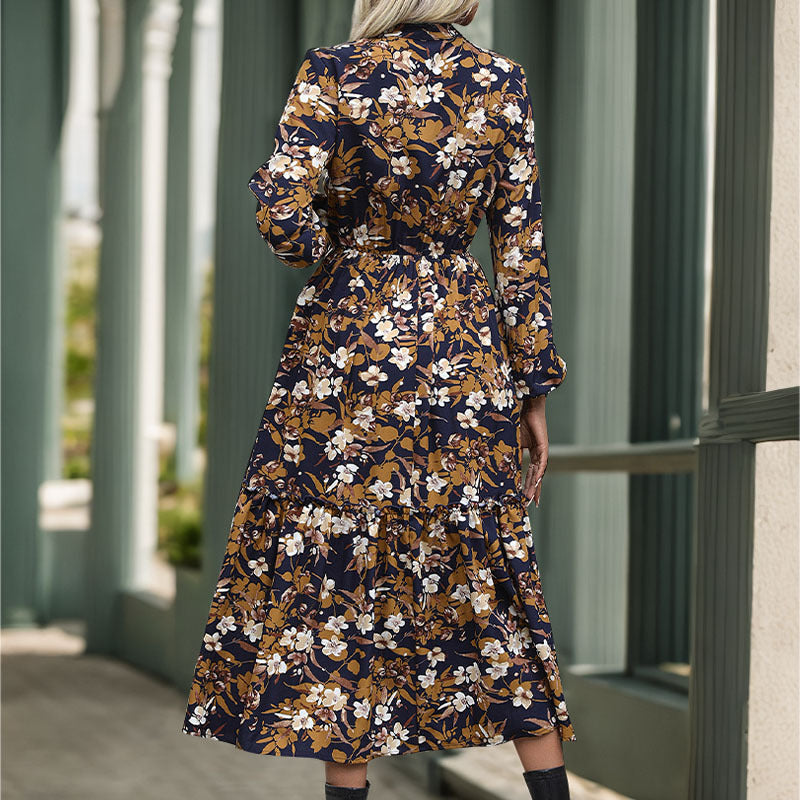 Women's midi dress with floral design and elegant waistline, size S