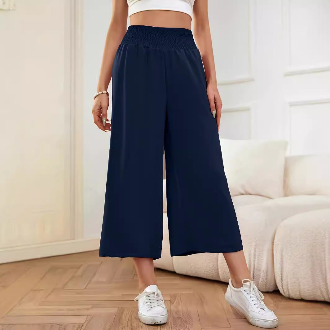 Women's wide-leg, high-waisted palazzo pants with elasticated waistband and flowing material, size S