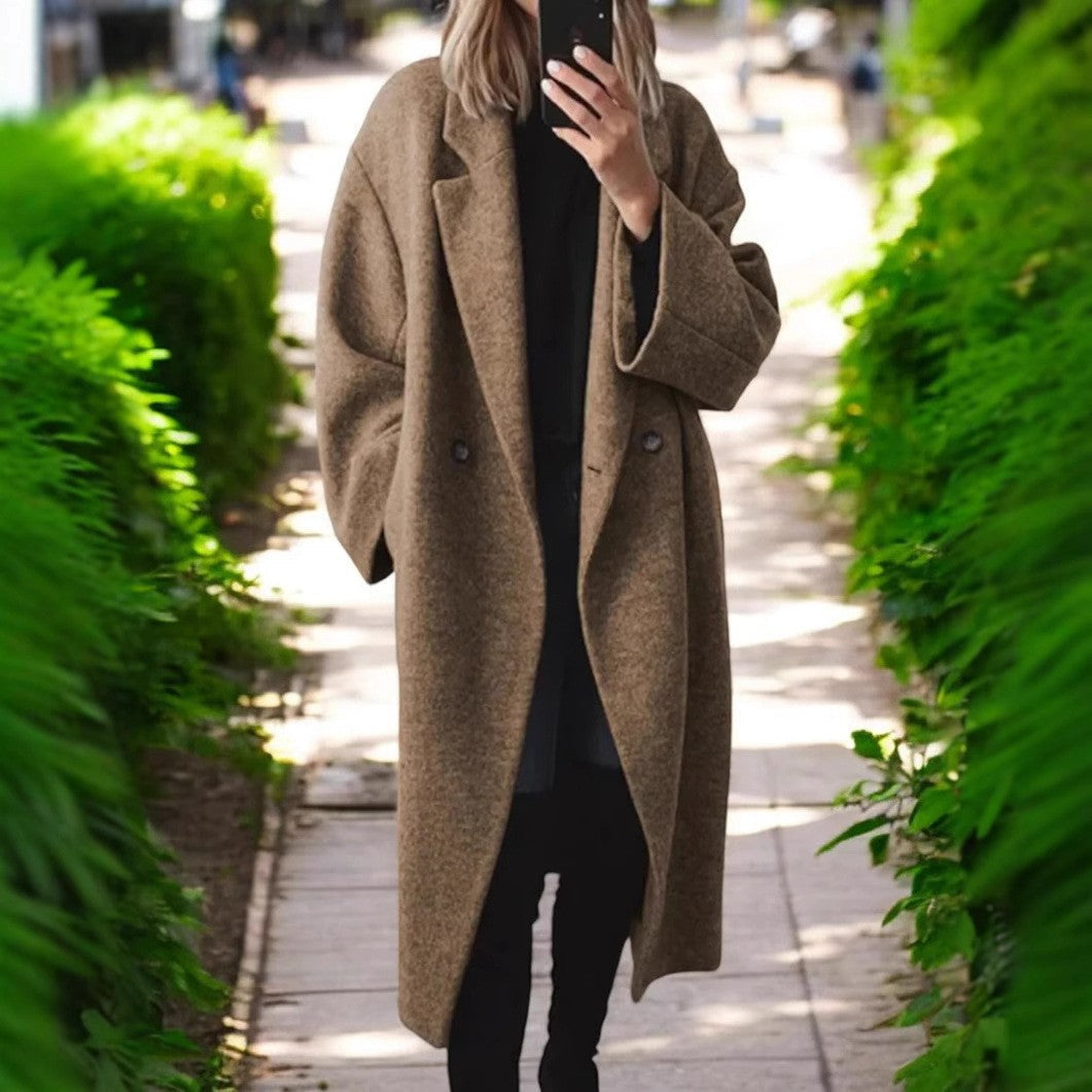 Women's oversized wool coat with an elegant cut and subtle snap buttons, size S