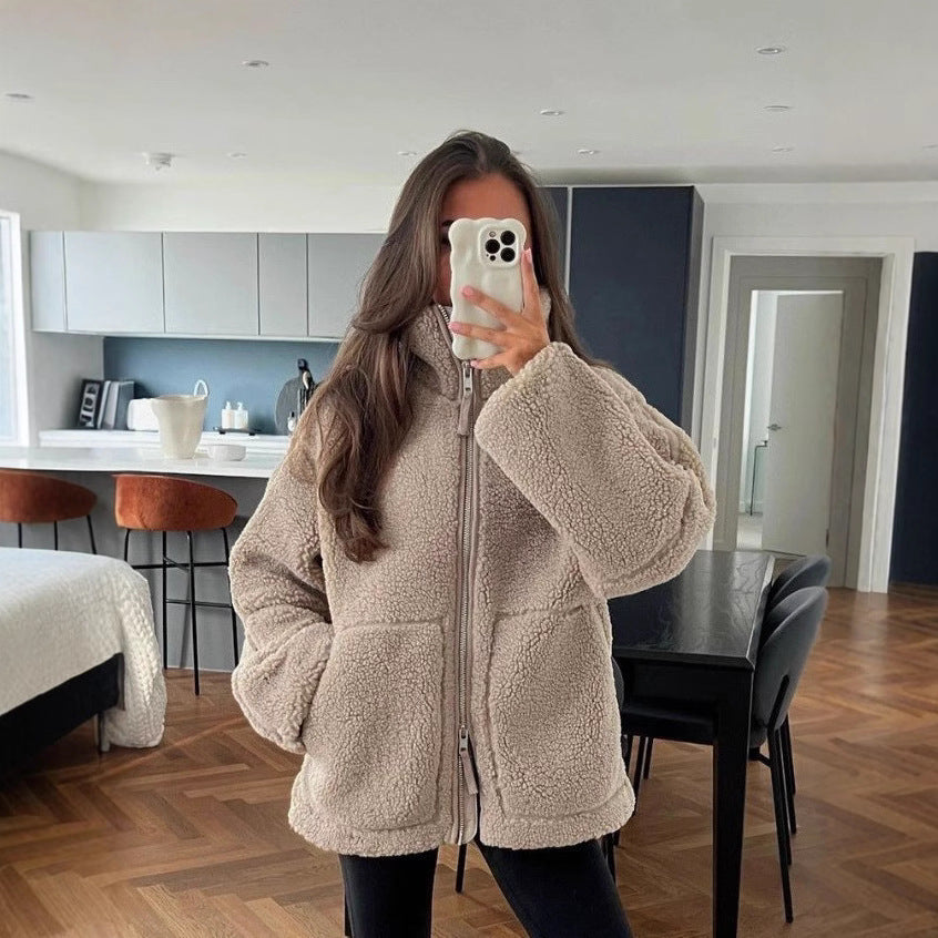 Women's cozy fleece jacket with high collar and practical pockets, size