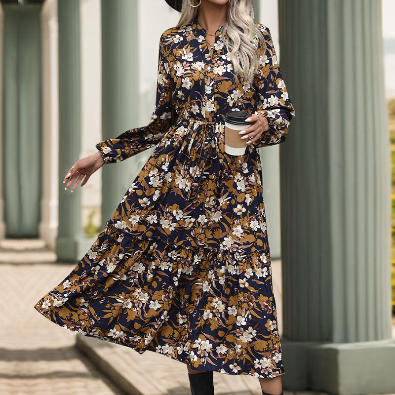 Women's midi dress with floral design and elegant waistline, size S