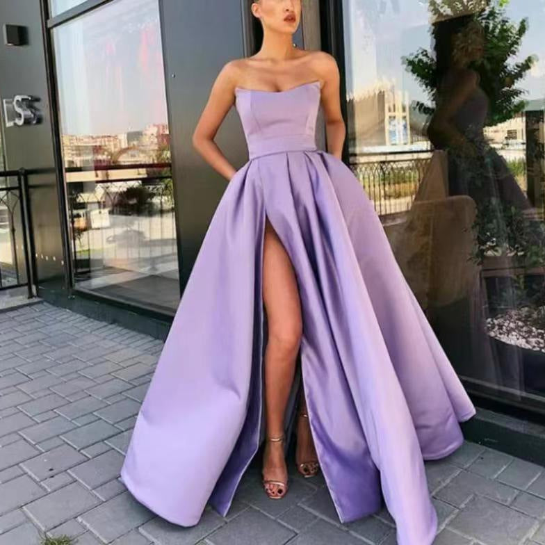Women's elegant evening dress with deep slit and flowing skirt, size [size]