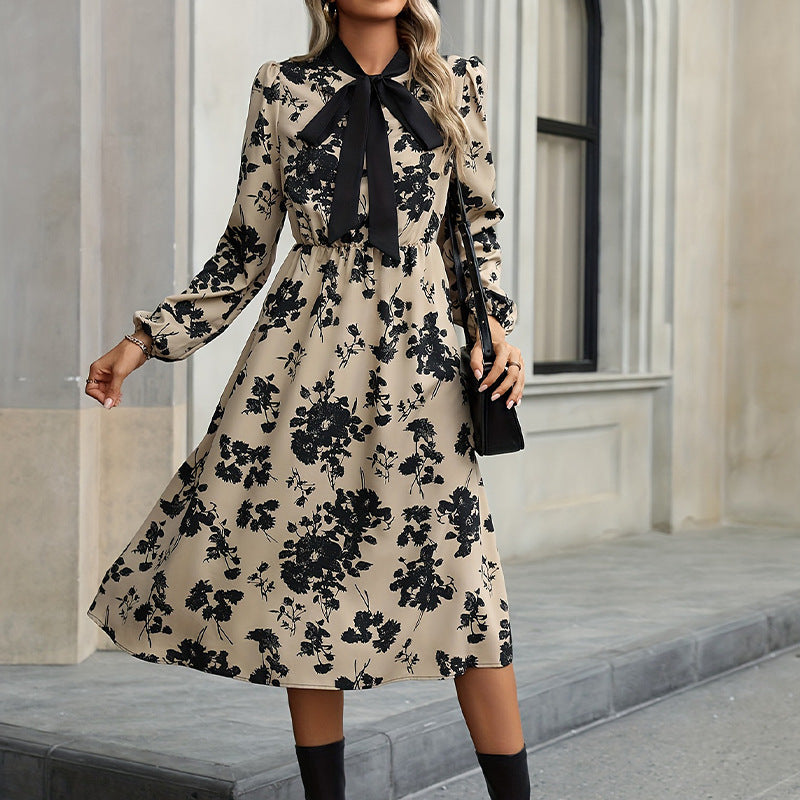 Women's elegant midi dress with floral pattern and bow details, size