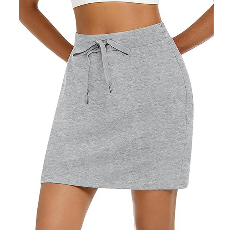 Women's sporty mini skirt with adjustable drawstring and side pockets, size