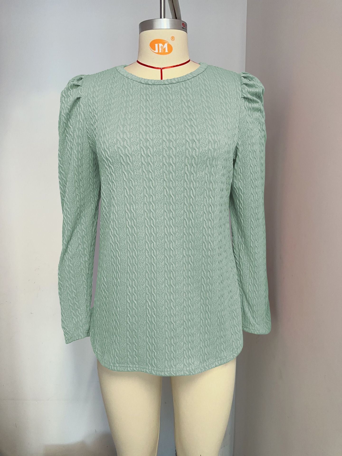 Women's elegant long-sleeved shirt with a textured pattern and puff sleeves, size