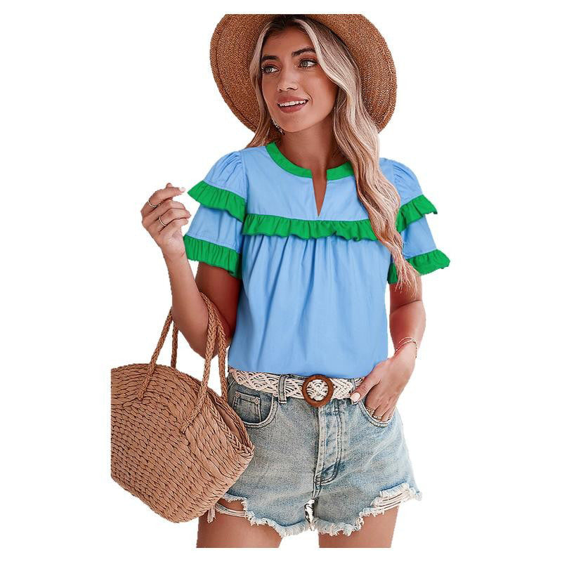 Women's casual blouse with ruffle details and modern accents, size [size missing]
