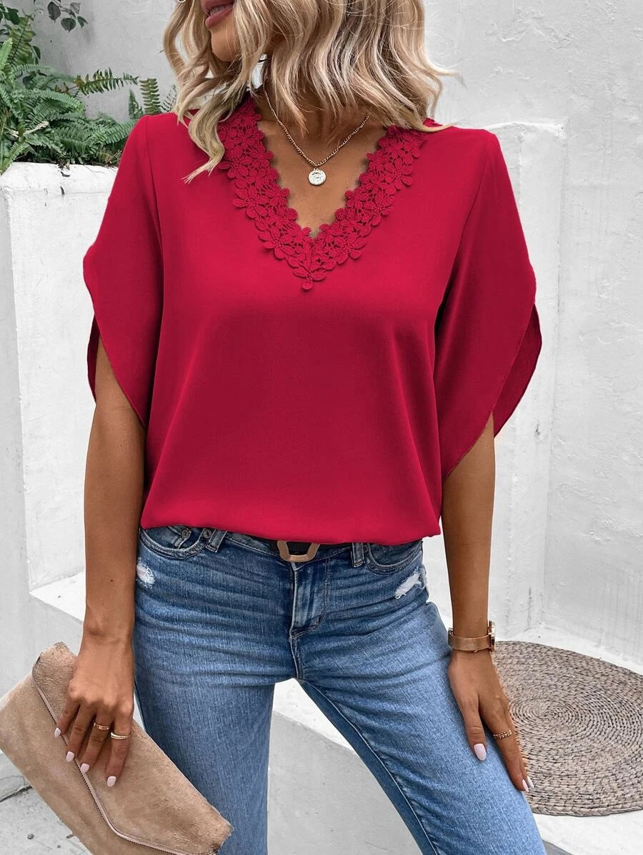 Women's blouse with floral lace appliqués and elegant cut-out sleeves, size S