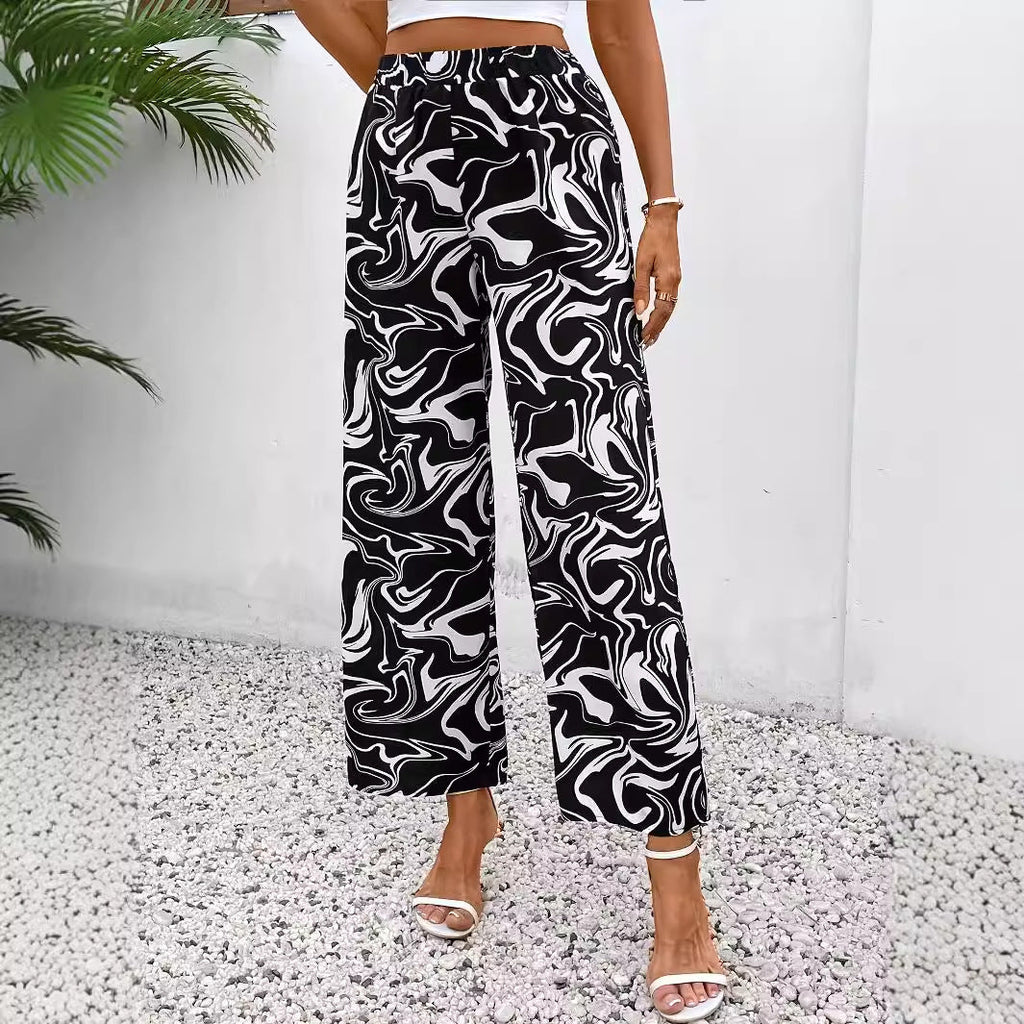 Women's wide-leg palazzo trousers with a modern marble print and elasticated waistband, size S