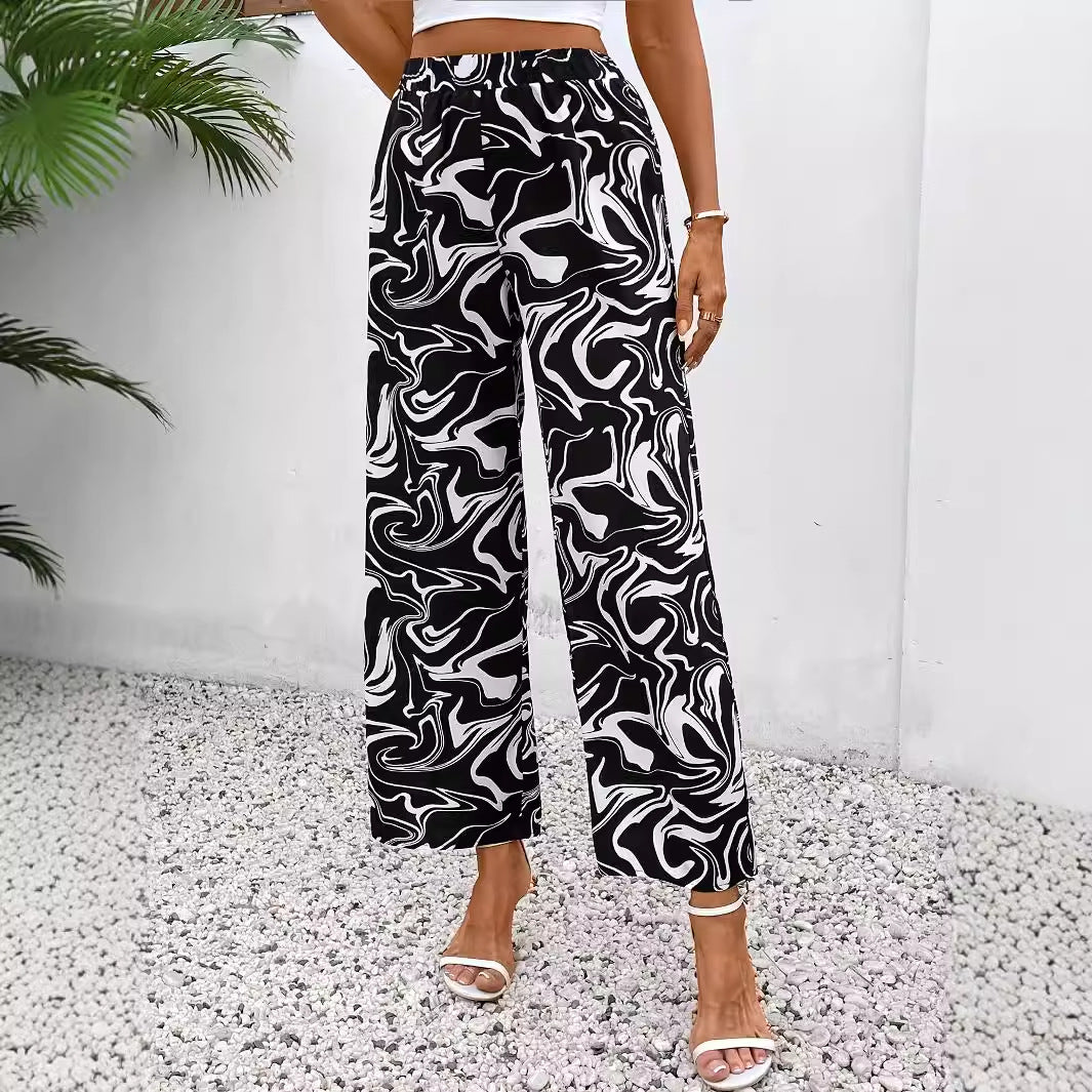 Women's wide-leg palazzo trousers with a modern marble print and elasticated waistband, size S