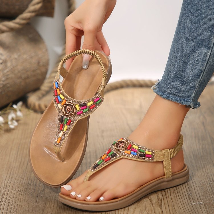 Women's thong sandals with colorful decorative detail and comfortable footbed design, size GR