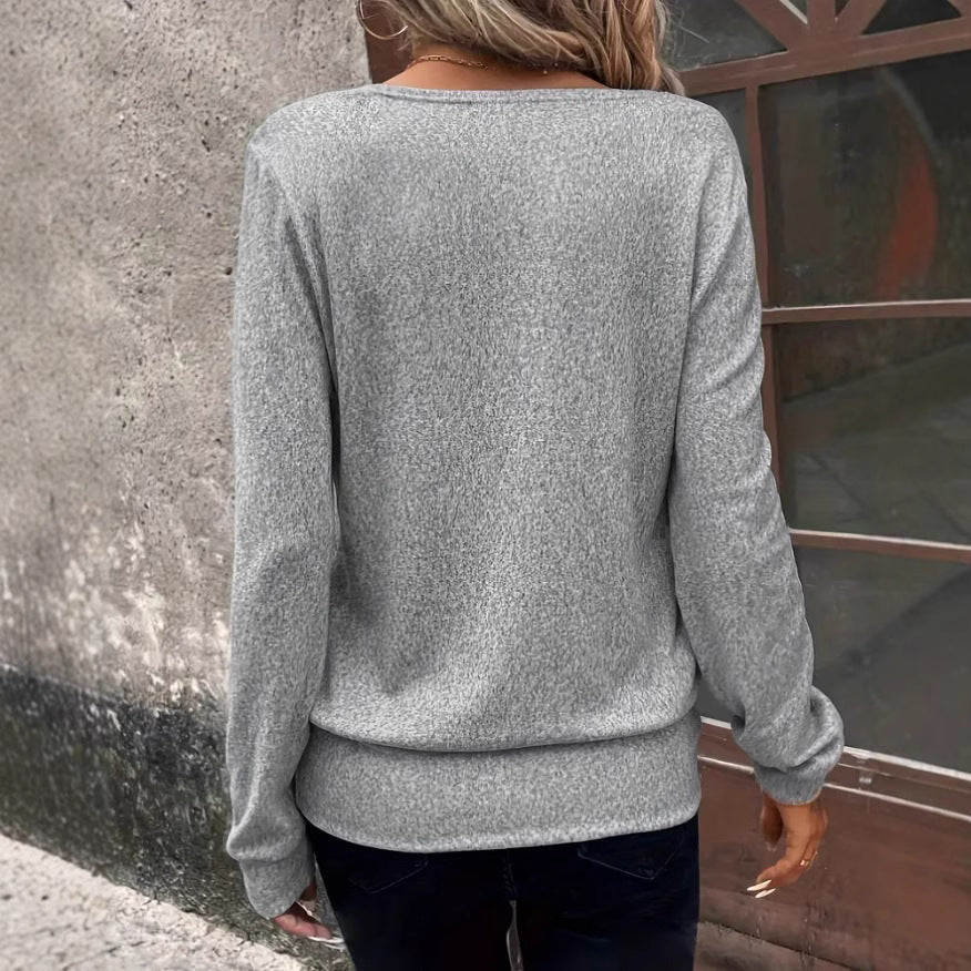 Women's elegant V-neck sweater with chic details, size