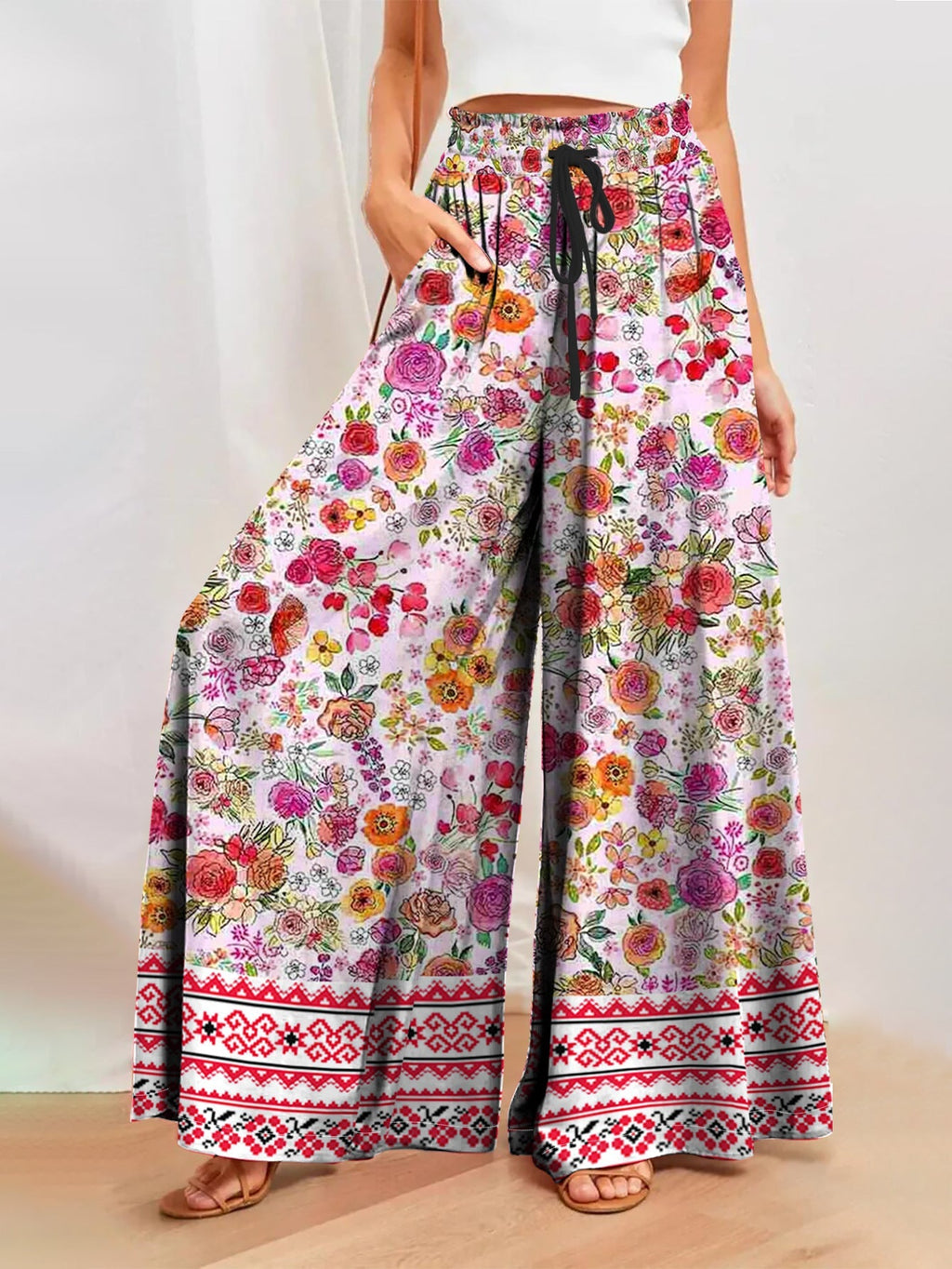 Women's wide-leg floral trousers with elasticated waistband and practical pockets, size