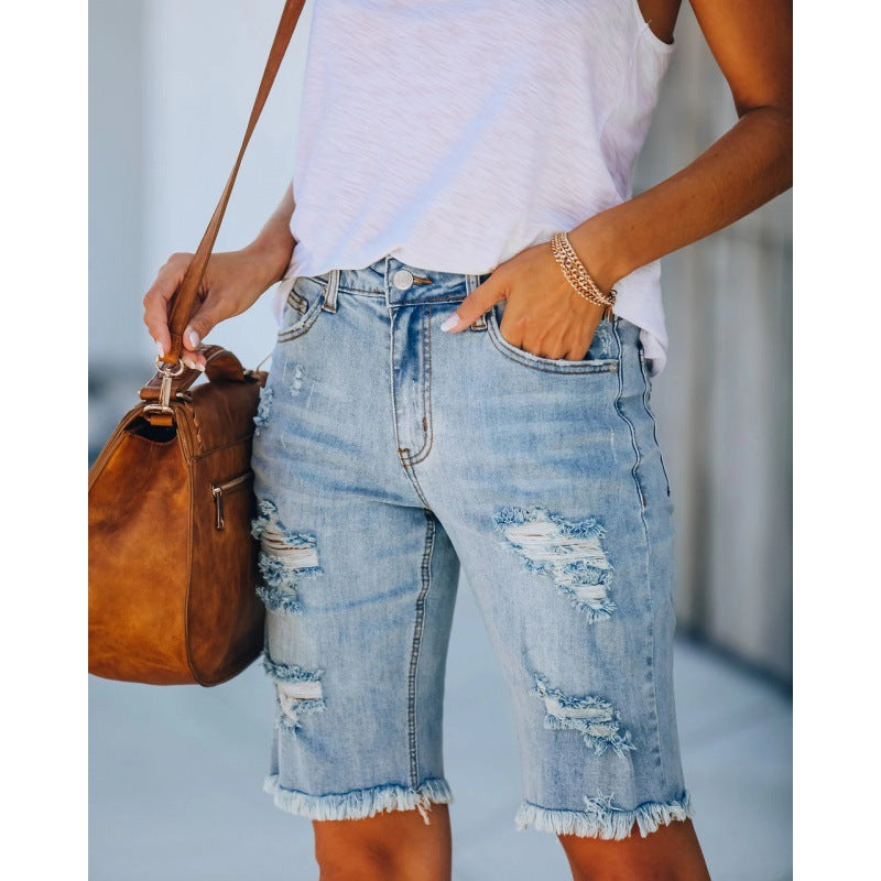 Women's distressed denim shorts in a relaxed fit with frayed hems, size [size missing]