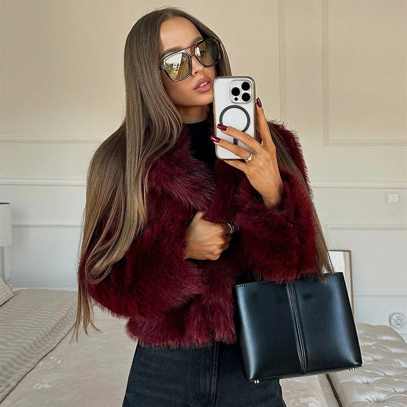 Women's faux fur jacket with a voluminous collar and elegant cut, size S
