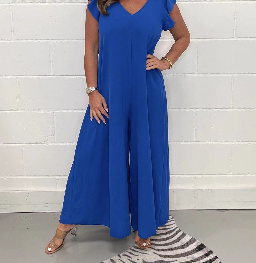 Women's upscale jumpsuit with voluminous ruffled sleeves and V-neck, size S