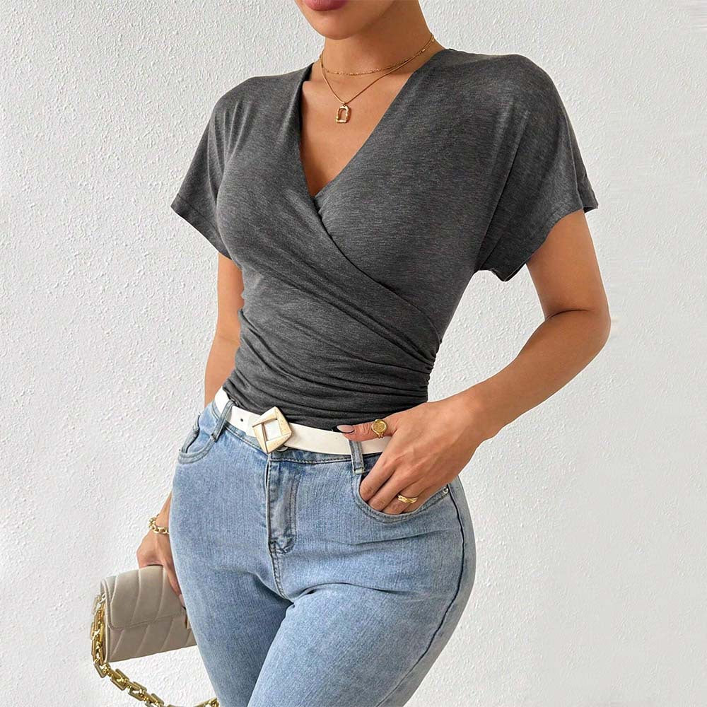 Women's wrap top with sophisticated ruching details, size S