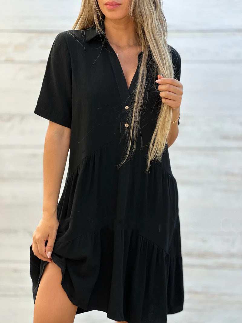 Women's loose-fitting shirt dress with button details and flowing hem, size