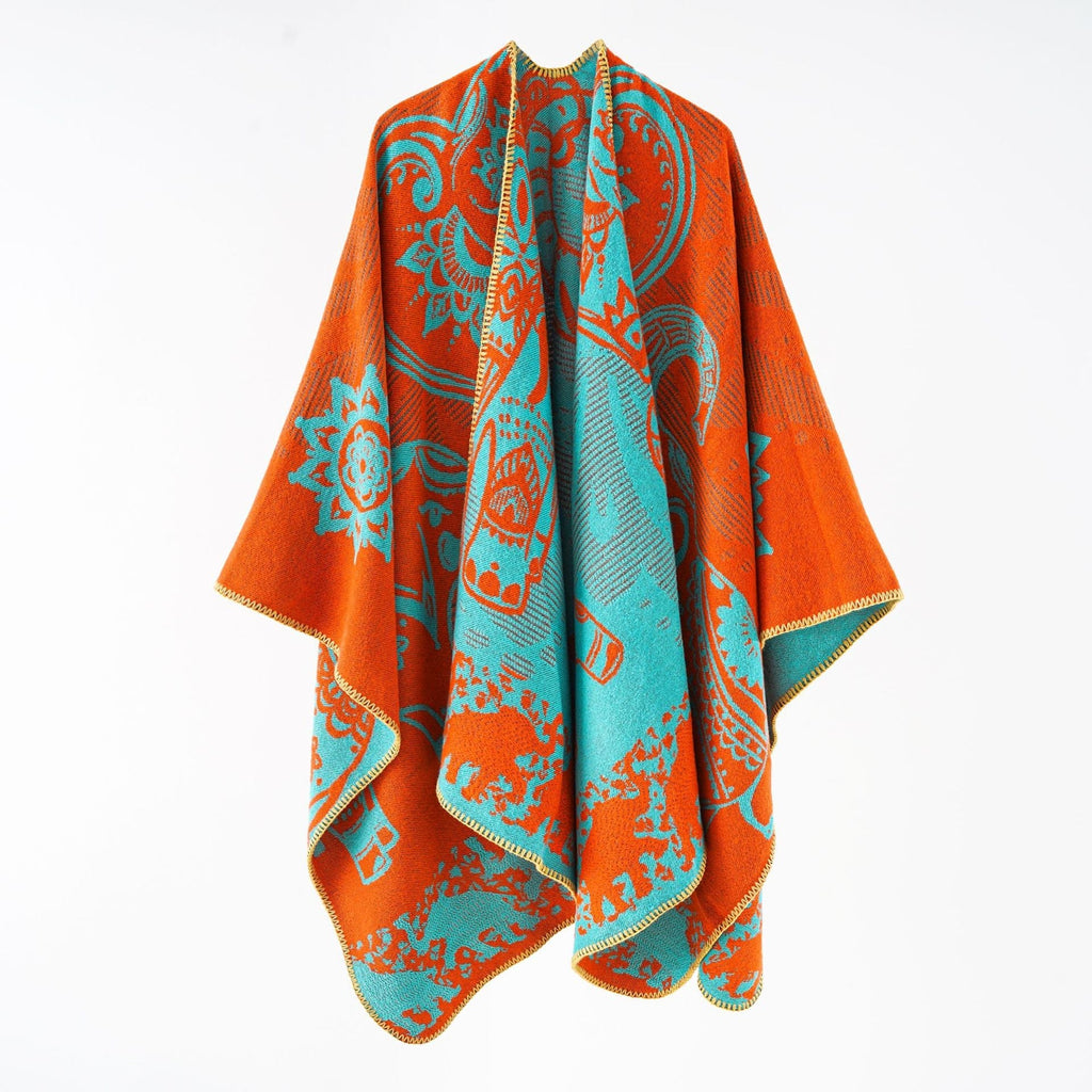 Women's elegant transitional poncho with an artistic floral pattern and fringed edges, size GR
