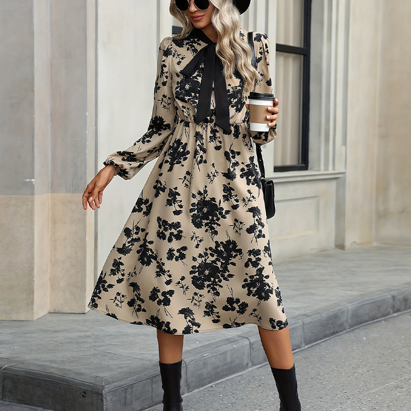 Women's elegant midi dress with floral pattern and bow details, size