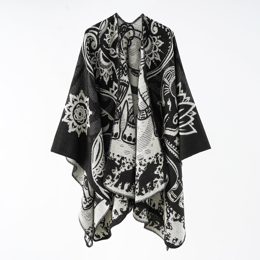 Women's elegant transitional poncho with an artistic floral pattern and fringed edges, size GR