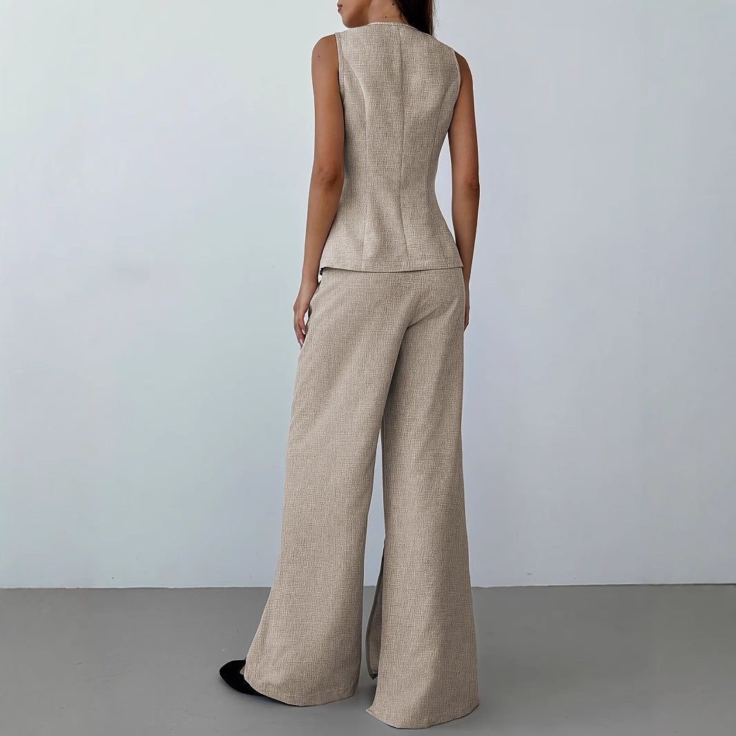 Women's elegant ensemble consisting of a sleeveless blazer and wide-leg trousers, size S