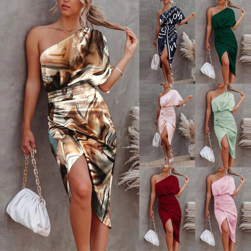 Women's chic, asymmetrical evening dress with an elegant slit and sophisticated draping, size GR