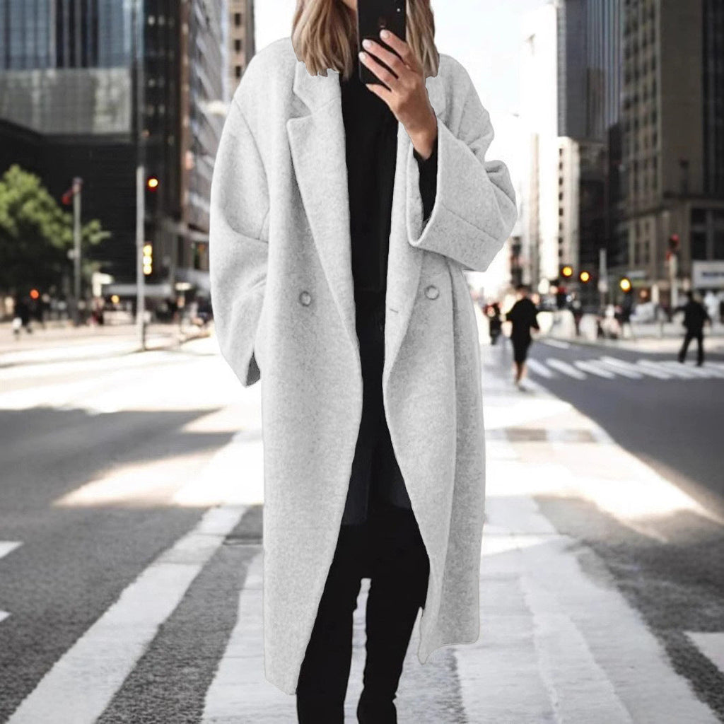 Women's oversized wool coat with an elegant cut and subtle snap buttons, size S