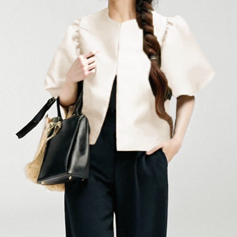 Women's blouse with voluminous puff sleeves and modern design, size S