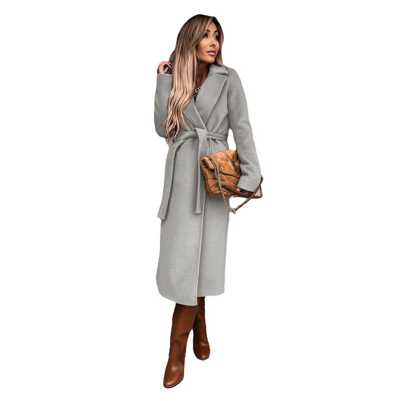 Women's elegant wool coat with tailored cut and belt, size S