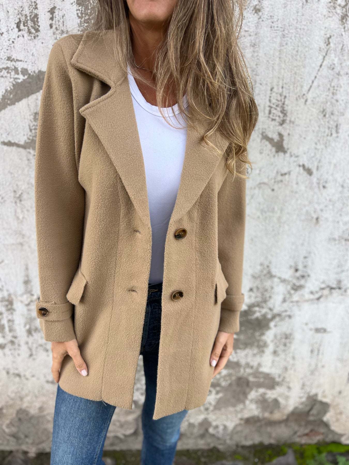 Women's oversized wool coat with fashionable lapels and practical pockets, size S