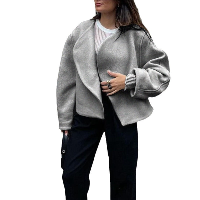 Women's short jacket made of cozy material with a wide cut and elegant details, size S