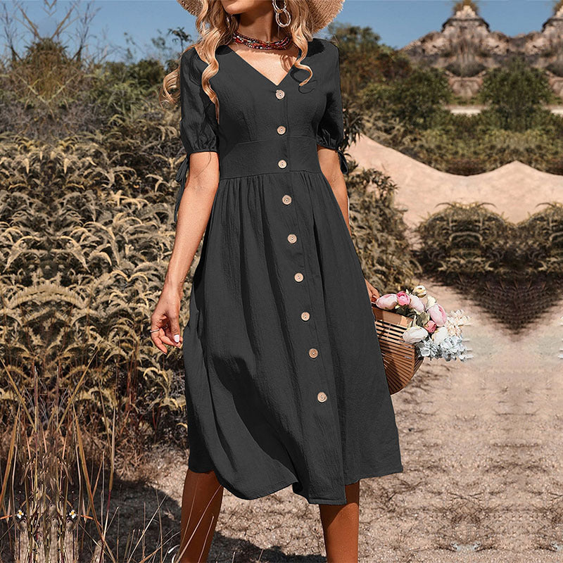 Women's midi dress with a tailored cut and modern button details, size [size]