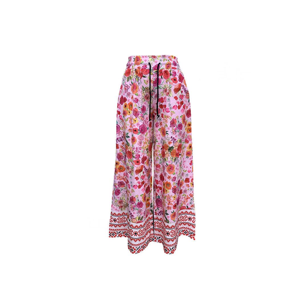 Women's wide-leg floral trousers with elasticated waistband and practical pockets, size