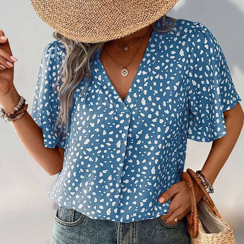 Women's short-sleeved blouse with a modern polka dot design and a relaxed fit, size [size missing]