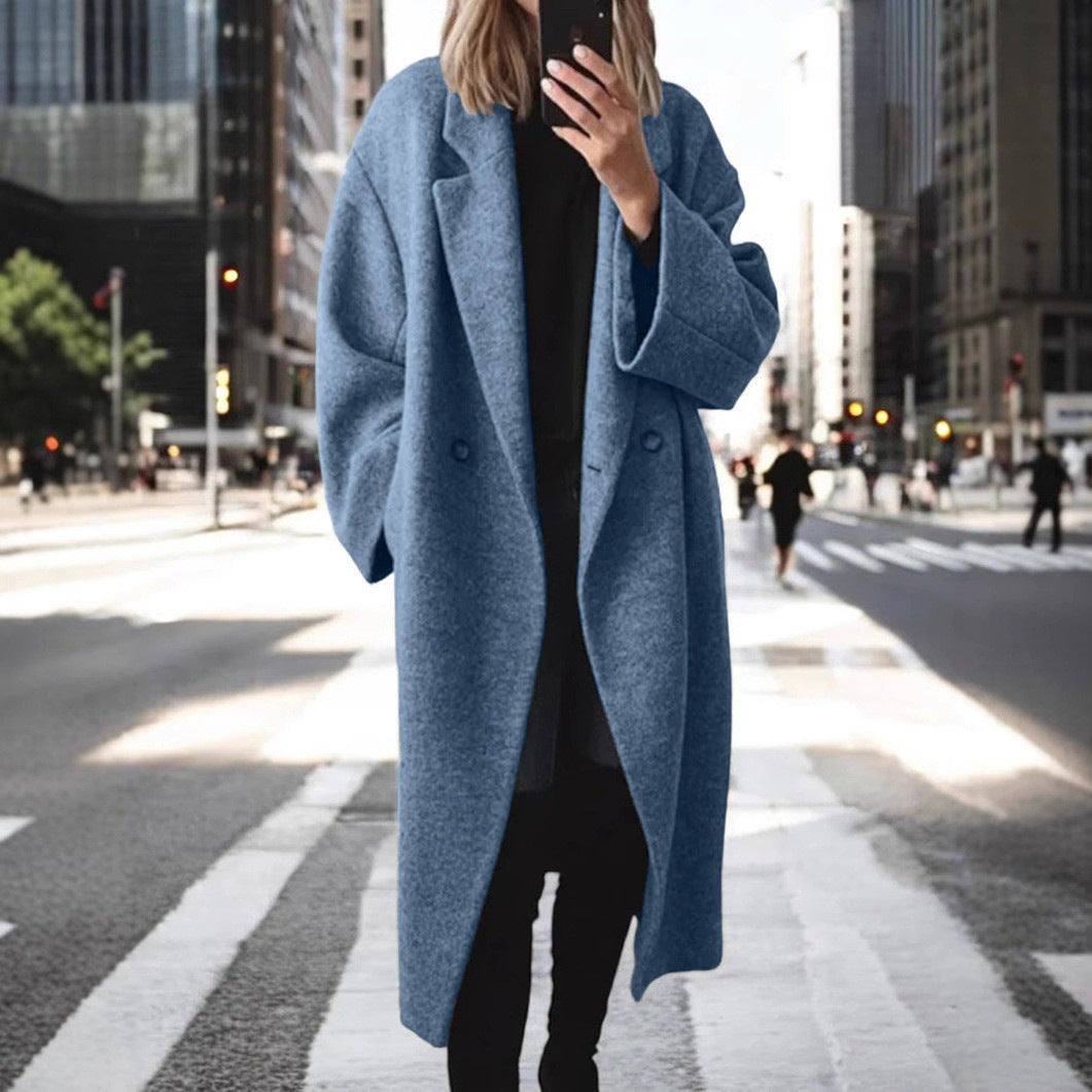 Women's oversized wool coat with an elegant cut and subtle snap buttons, size S