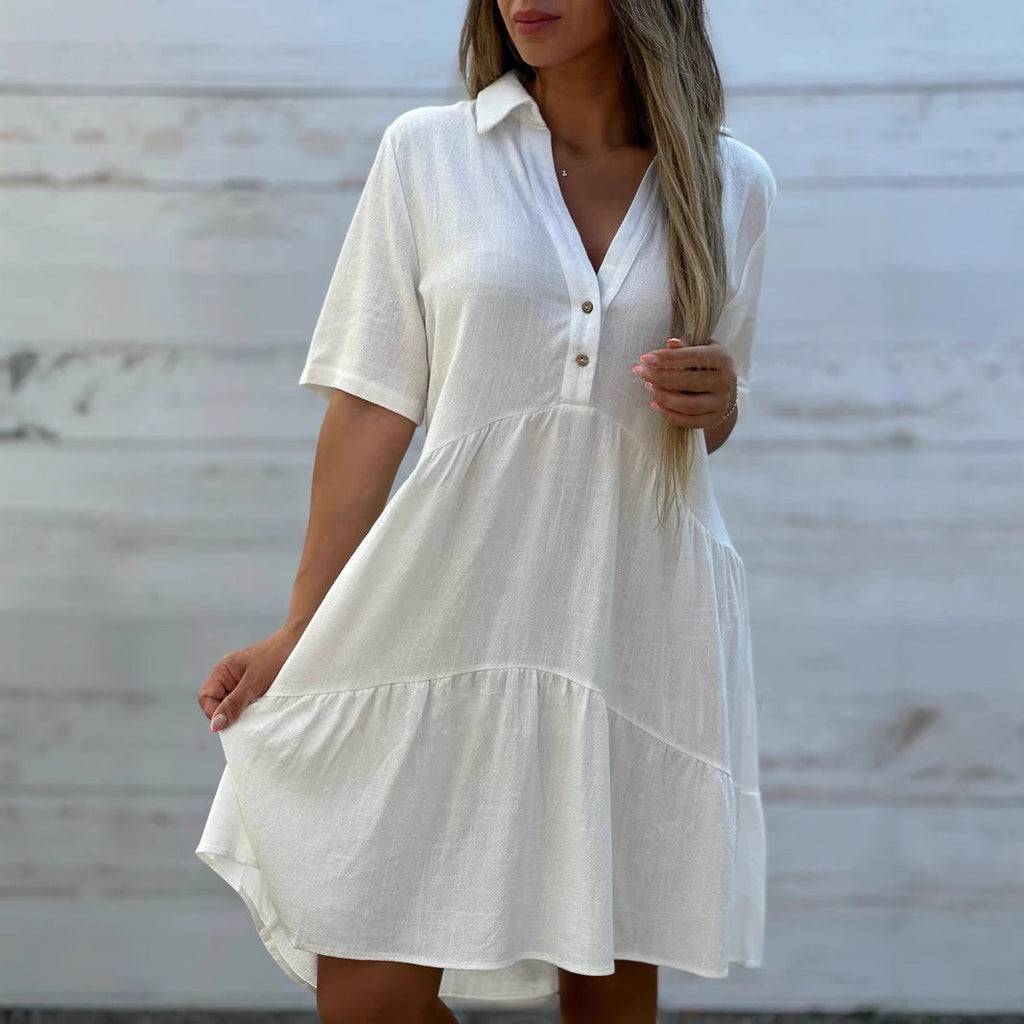Women's loose-fitting shirt dress with button details and flowing hem, size