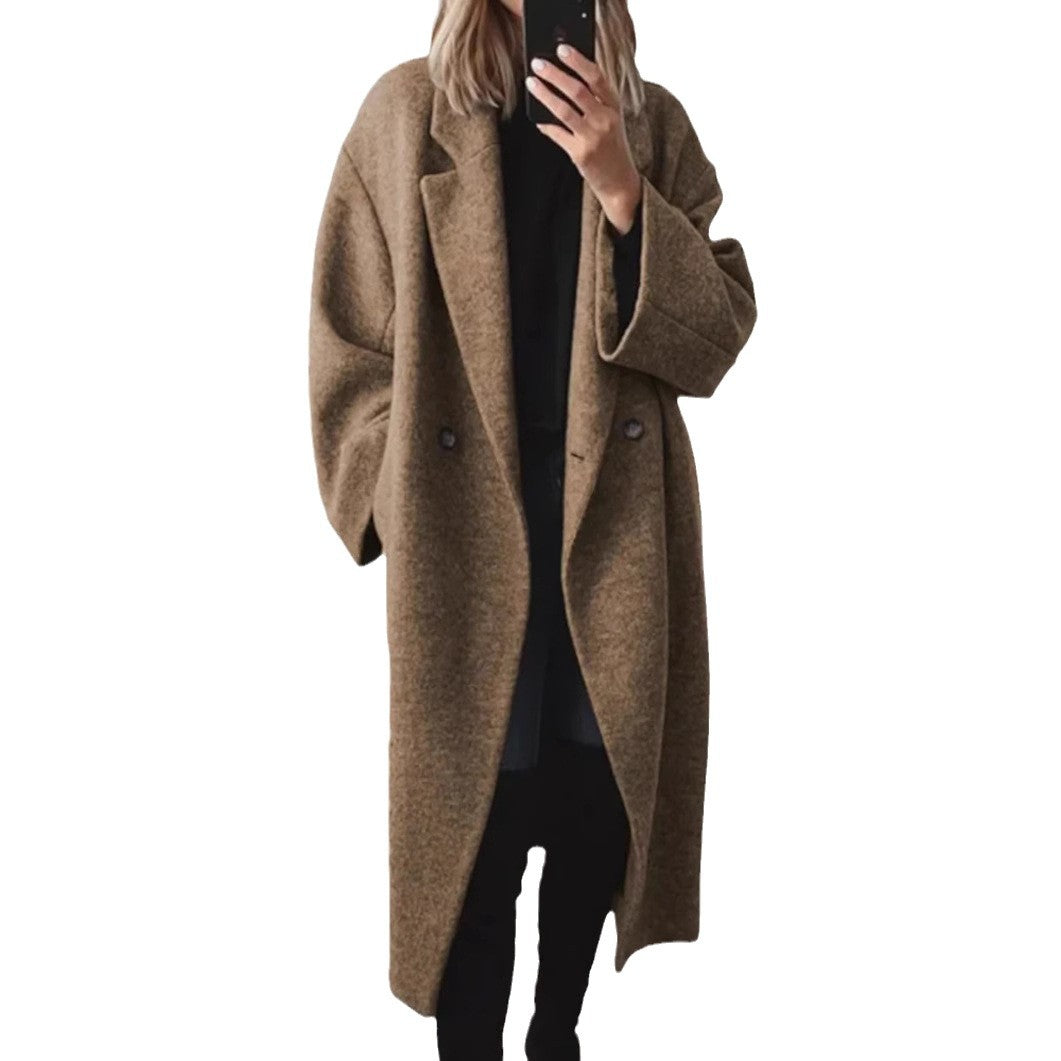 Women's oversized wool coat with an elegant cut and subtle snap buttons, size S