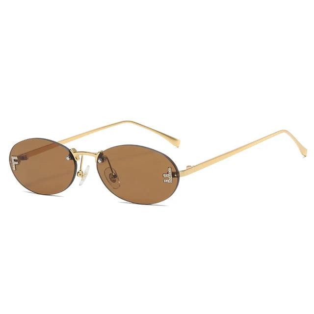 GR | Oval sunglasses with golden accents and subtle stones