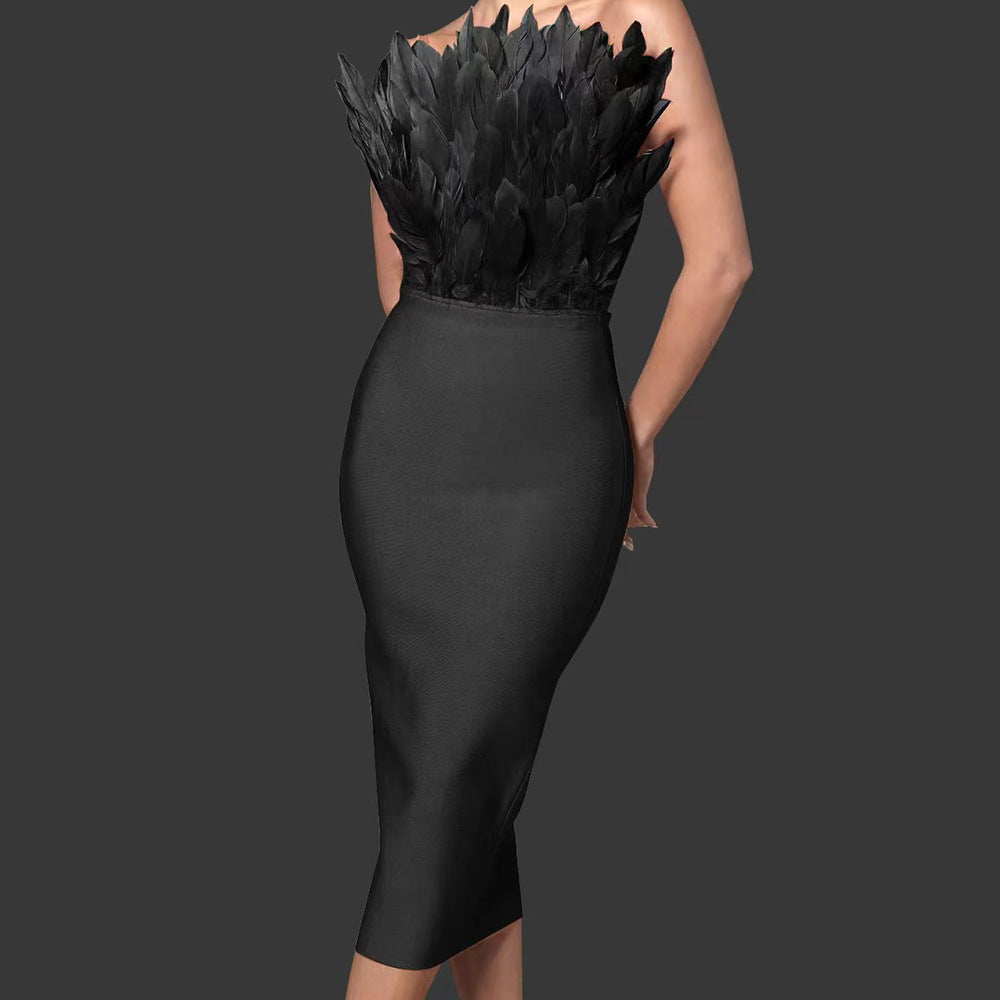 GR women's dress with waist accentuation and feather embellishment