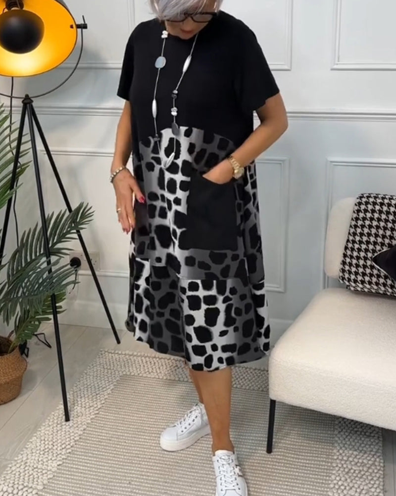 GR | Short-sleeved, printed dress with a round neckline